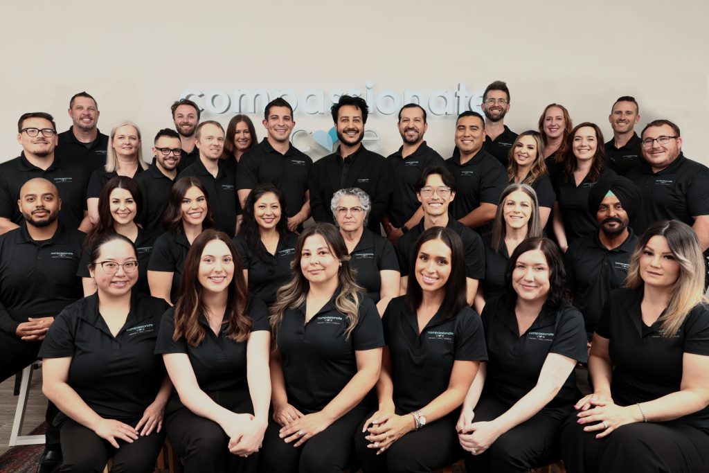 Compassionate Care home health, hospice, and in-home care team members gathered for a professional group photo