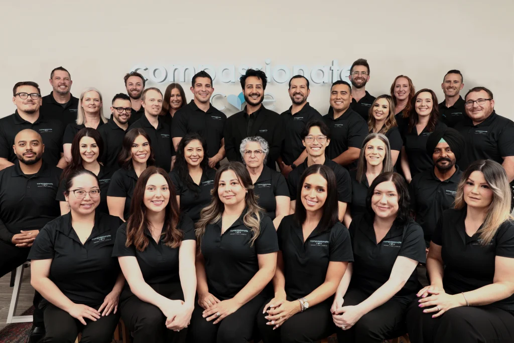 Compassionate Care home health, hospice, and in-home care team members gathered for a professional group photo